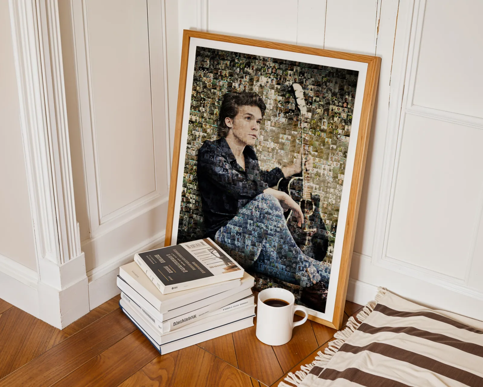 Man With Guitar Photo Mosaic Framed photo mosaic portrait of a young man sitting with his guitar, displayed beside a stack of books and a cup of coffee.